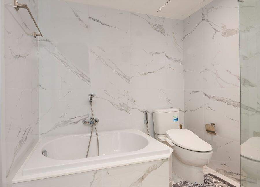 The second marble bathroom with a bathtub