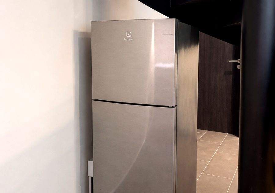 A full height stainless steel fridge freezer in the corridor at The Elite @ Pattaya